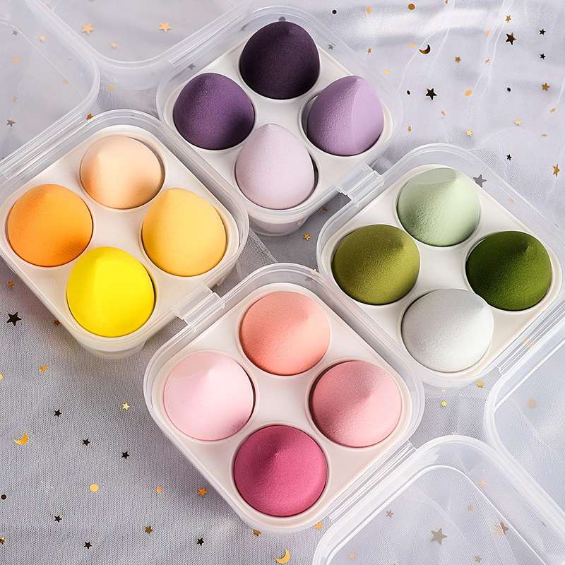 Foriegn 4-pack of wet and dry beauty sponges in a boX