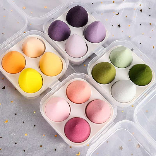 Foriegn 4-pack of wet and dry beauty sponges in a boX